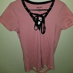 pink shirt with rips